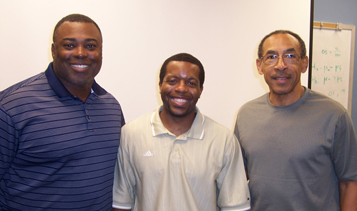 Leroy Burrell, UH Track & Field Coach, and Sean Golden, Gymnastic club coach, pose with Dr. Pearson 